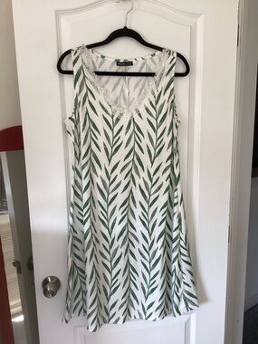Sleeveless White Maxi Dress with Green Leaf Print and Lace Trim